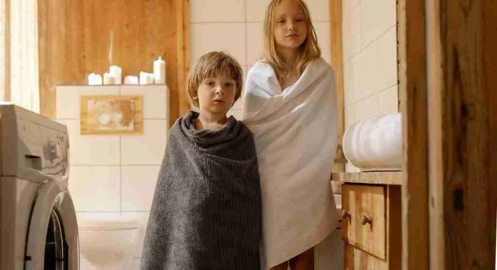 Child seeing a ready towel before washing hands at home