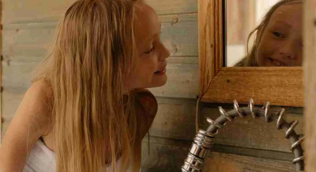 Child noticing a ready towel near the sink before washing hands