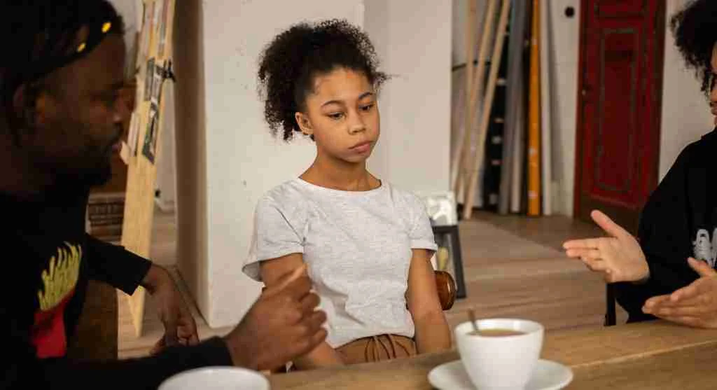 Parent and child calmly revisiting a disagreement after emotions settle