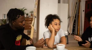Parent calmly repeating a decision to a child at home