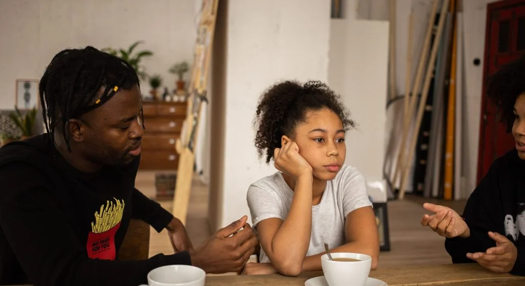 Parent calmly repeating a decision to a child at home
