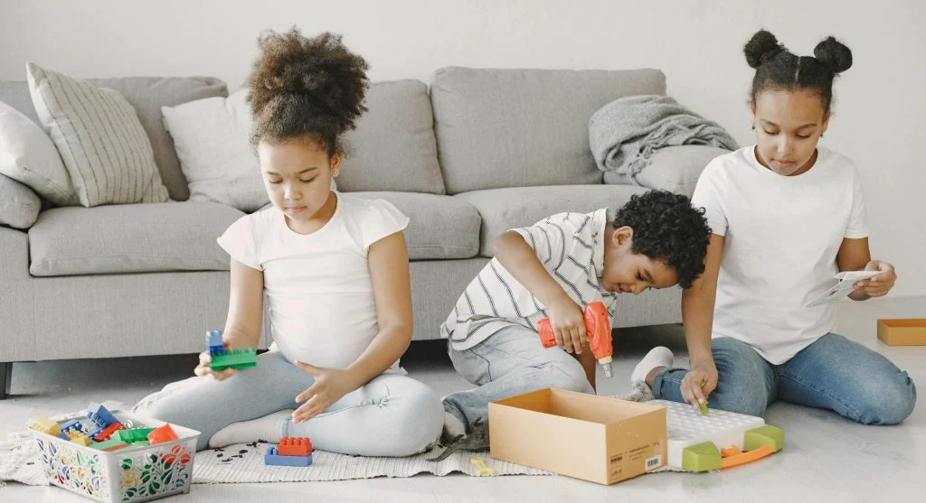 Siblings playing together at home