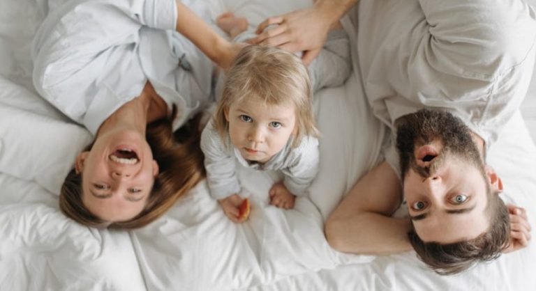 happy family having breakfast together