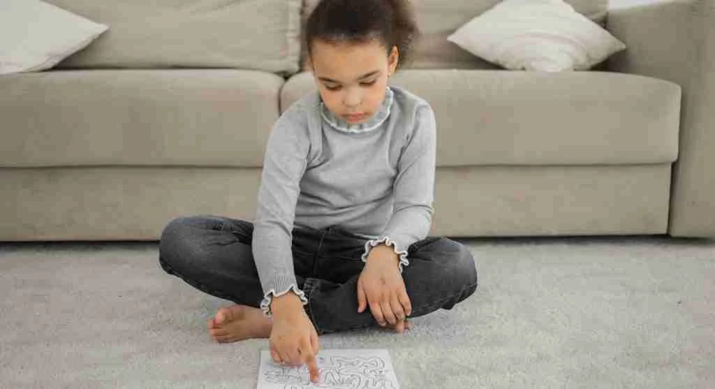 Child thinking carefully while explaining a forgotten task at home
