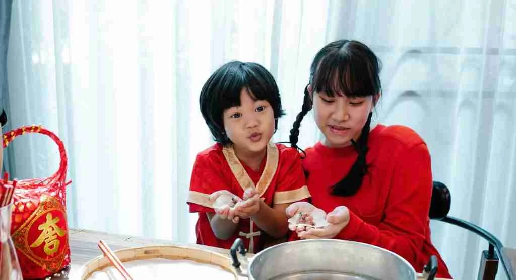 Child looking proud while helping begin a family tradition at home