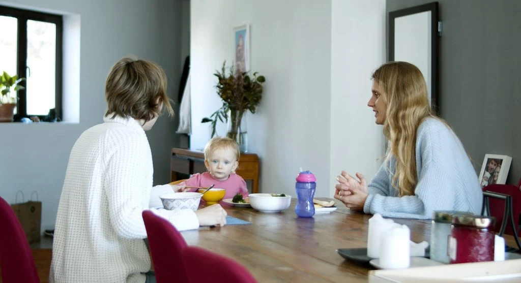 Child learning to wait after hearing not yet during a home routine