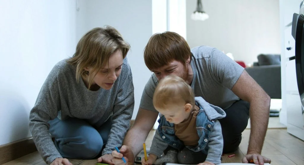 Parent and child ending a home practice session with a quick successful activity