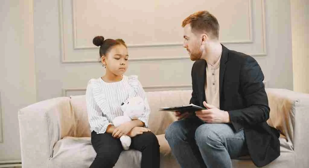 Parent helping a child talk about feeling left out after play