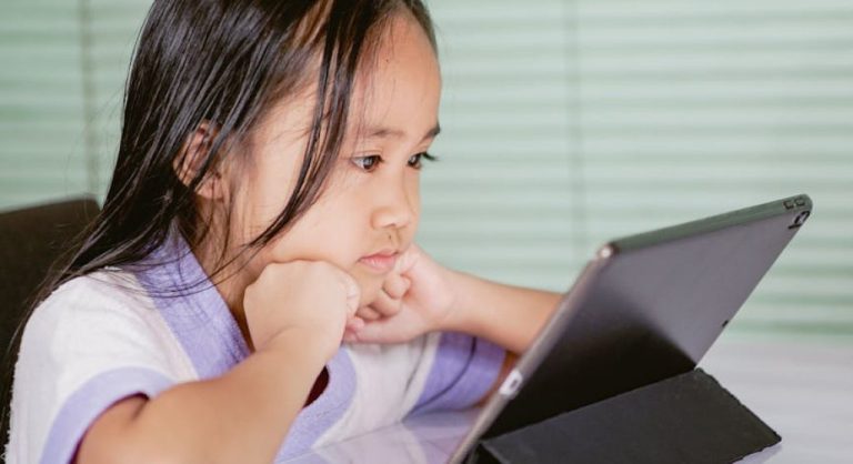 kid using tablet computer