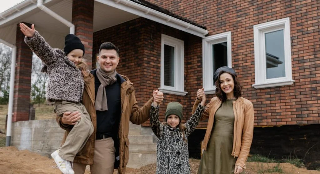 family smiling together in living room
