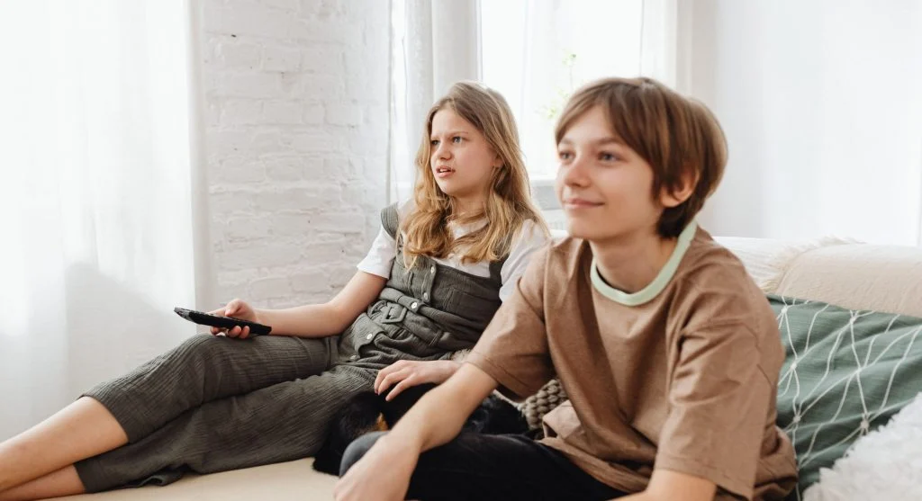 Children taking turns deciding what to watch before TV time starts