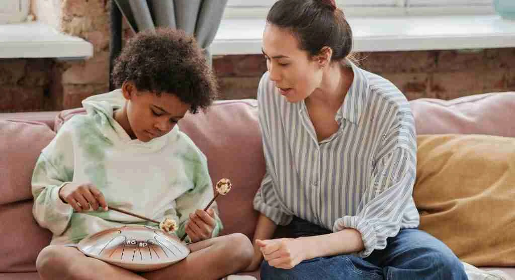 Parent talking calmly with a child after the immediate instruction moment has passed