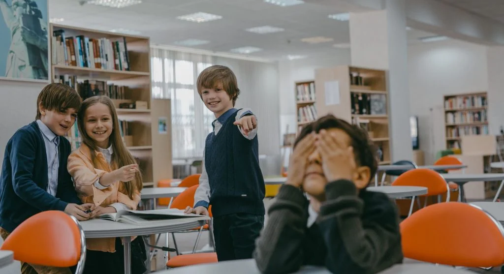 Child pointing to a nonfiction sentence before answering a comprehension question