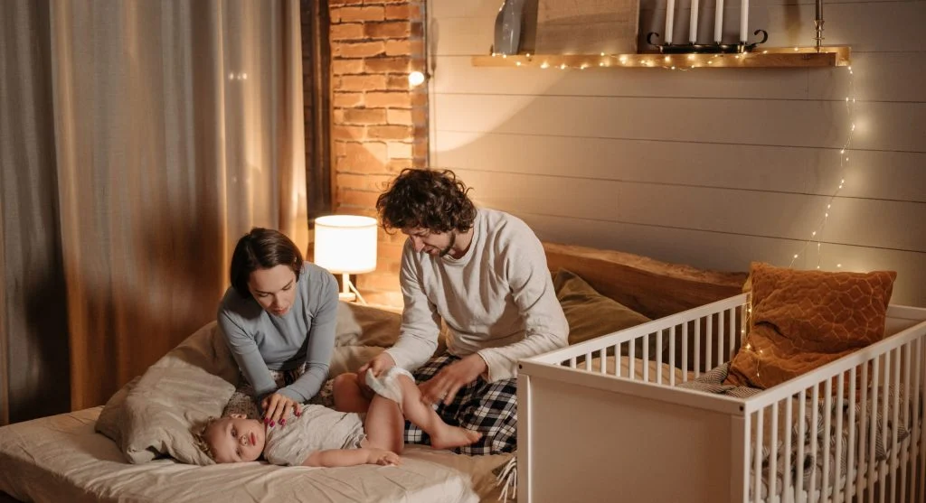 Parent staying calm during a child’s bedtime silliness at home