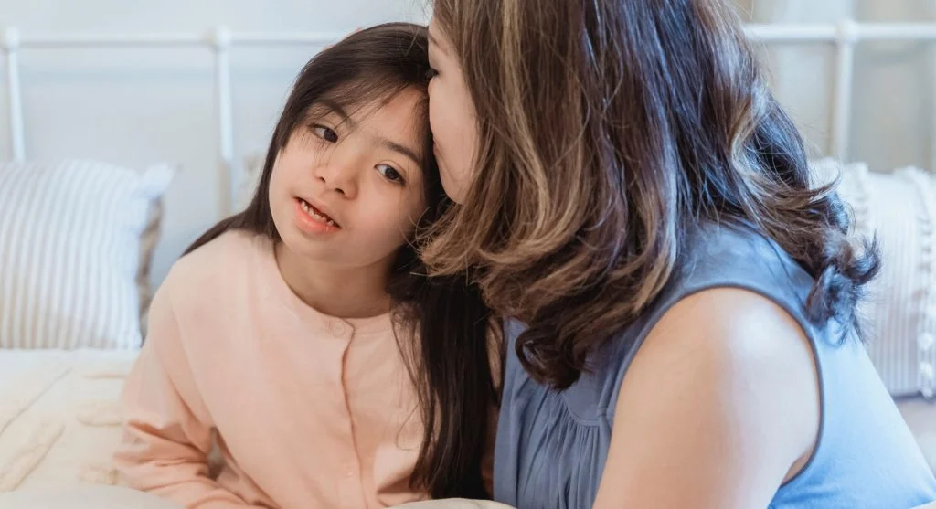 Child listening while a parent calmly acknowledges a hard moment at home