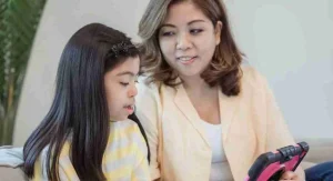 Parent showing a child where a device will go before screen time ends