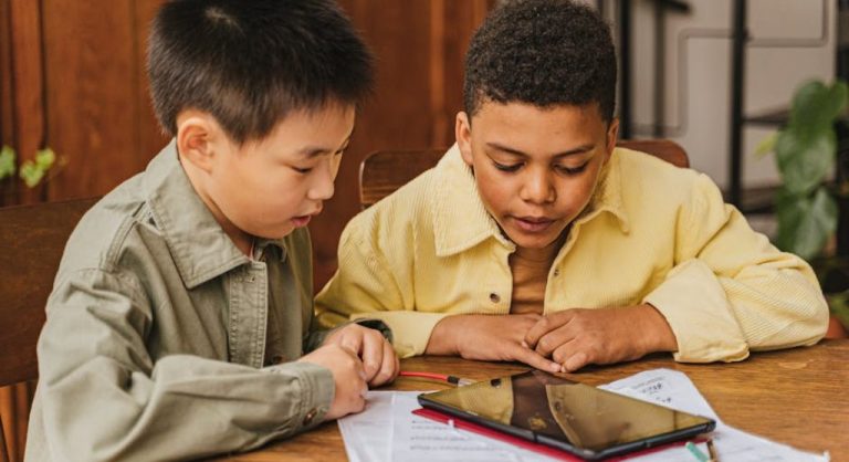 kid learning on tablet device