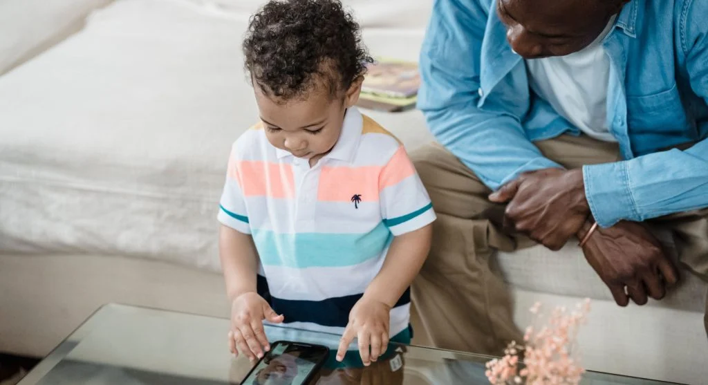 Parent helping a child transition calmly after a finished video call