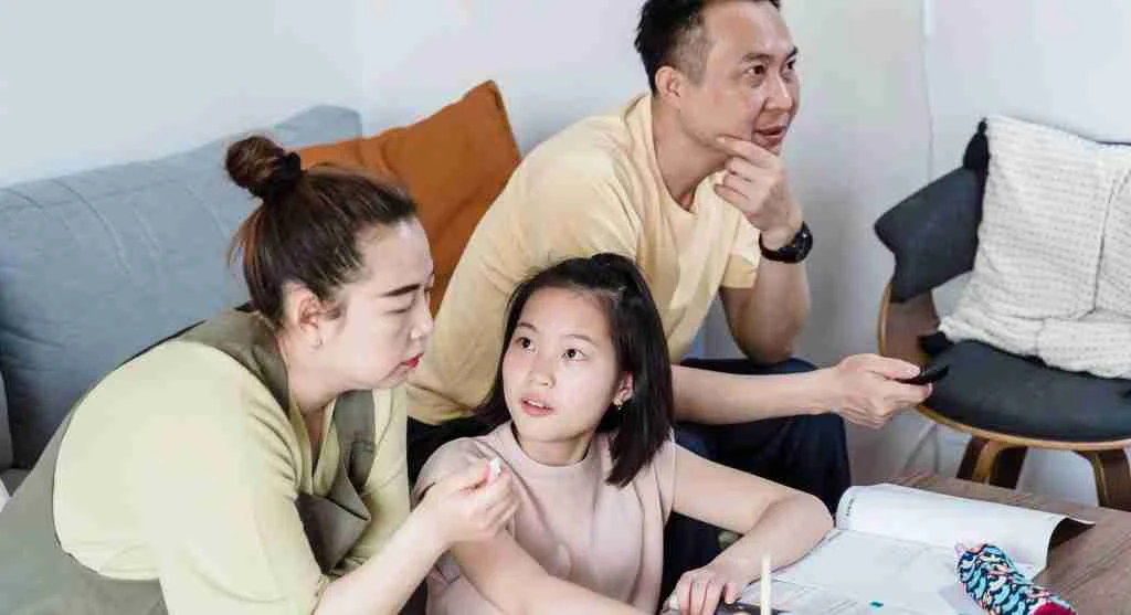 Parent calmly explaining privacy and respect to a child at home