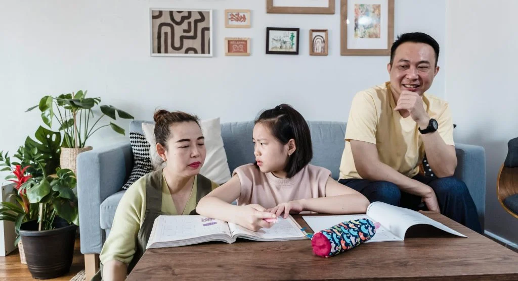 parent helping child with homework