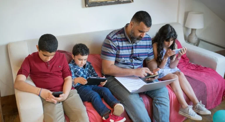 children using tablets with parents
