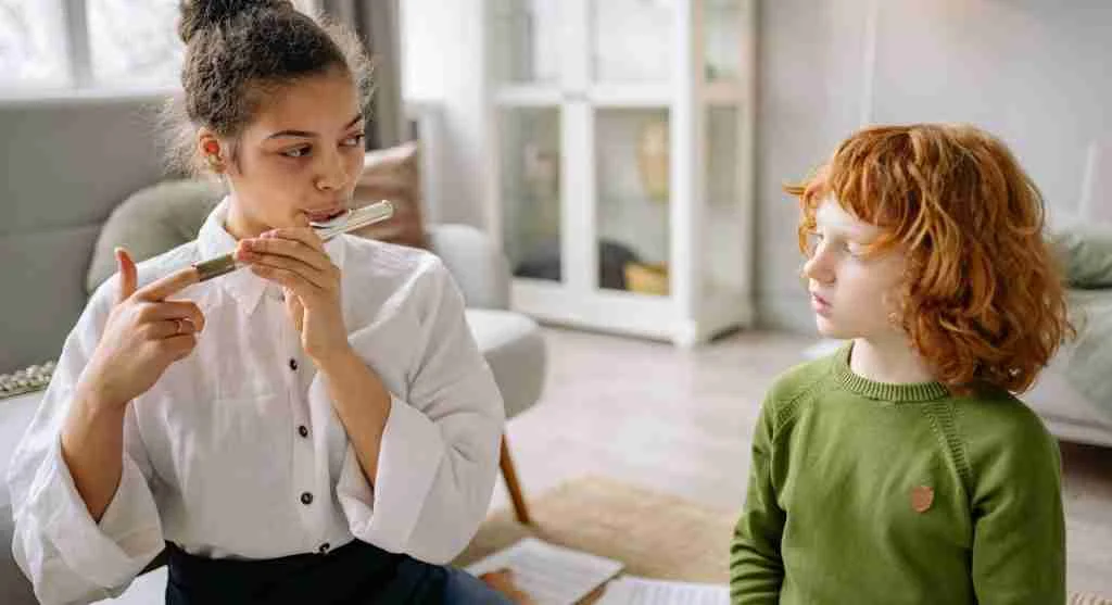 Child listening carefully to a short clear instruction at home