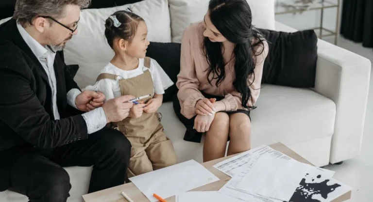 Parent calmly talking with a child after a small social mistake at home