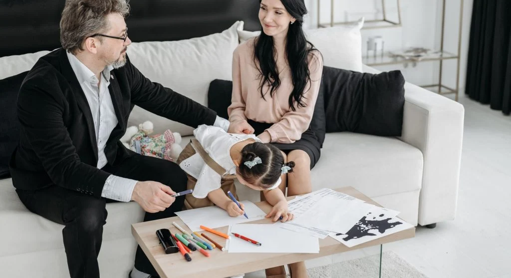 Parent giving a child a clear and specific correction at home