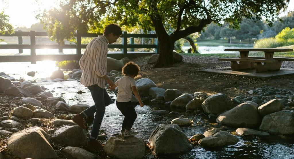 parent and child walking outdoors together