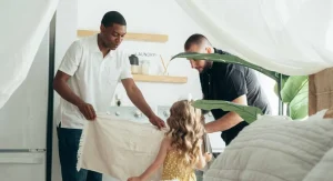 Parent preparing a child’s routine space before the routine begins at home