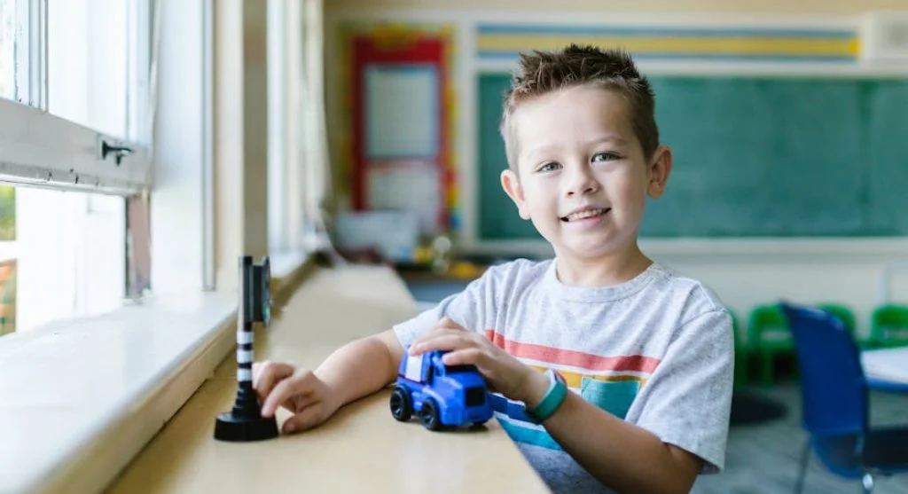 smiling child reading book