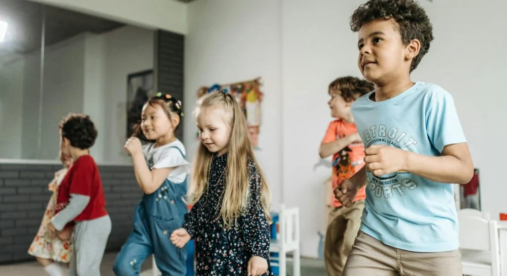 children sharing toys and taking turns