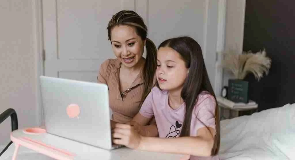 Parent using a calm sound-lowering routine before ending video time at home