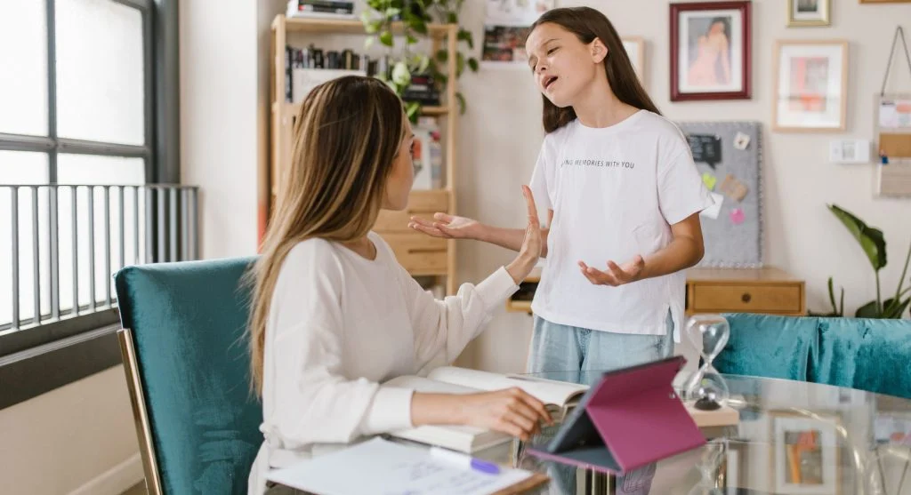 Parent inviting a child into an open honest conversation at home