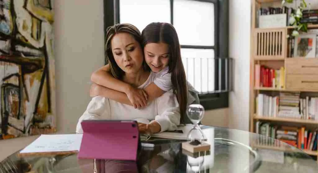 Parent and child closing an app together before tablet time ends