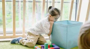 Child feeling left out while watching other children play