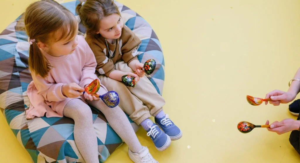 Child watching turn-taking closely during a shared game at home