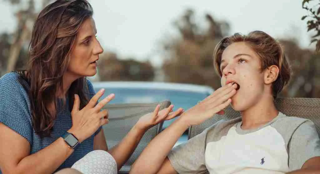 Child trying to explain a fairness concern during a home conversation