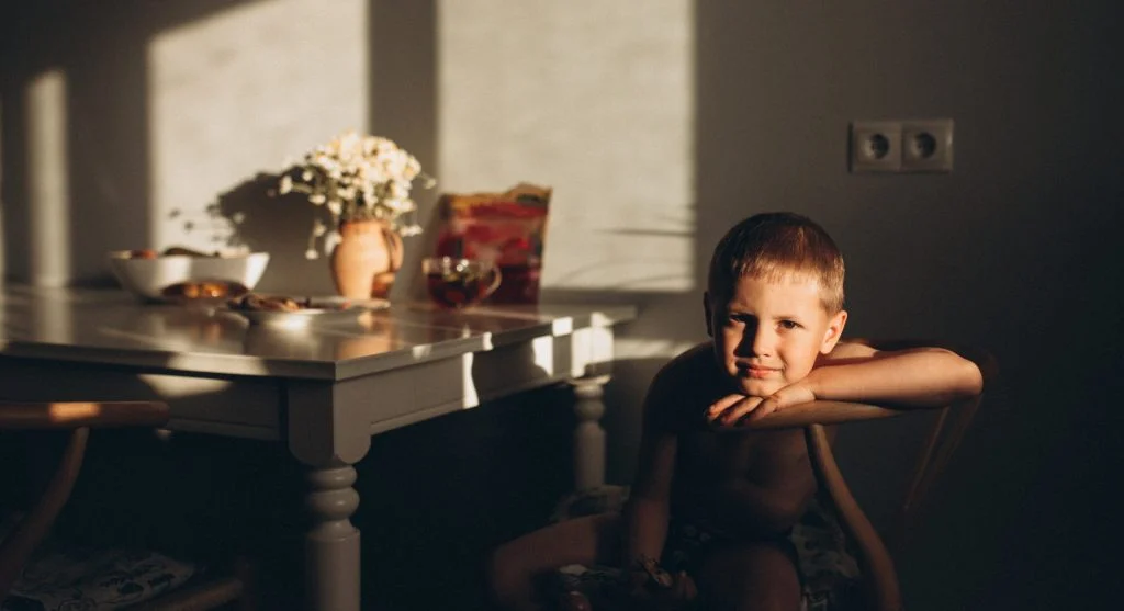 Child settling into a familiar after-school snack routine at home