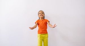 smiling kid listening to teacher