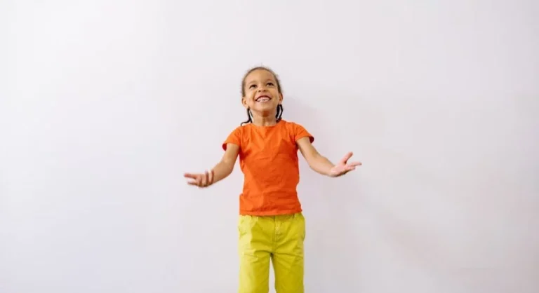 smiling kid listening to teacher