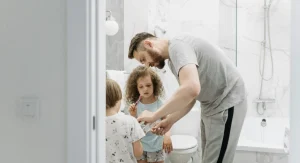 parent guiding child through morning routine
