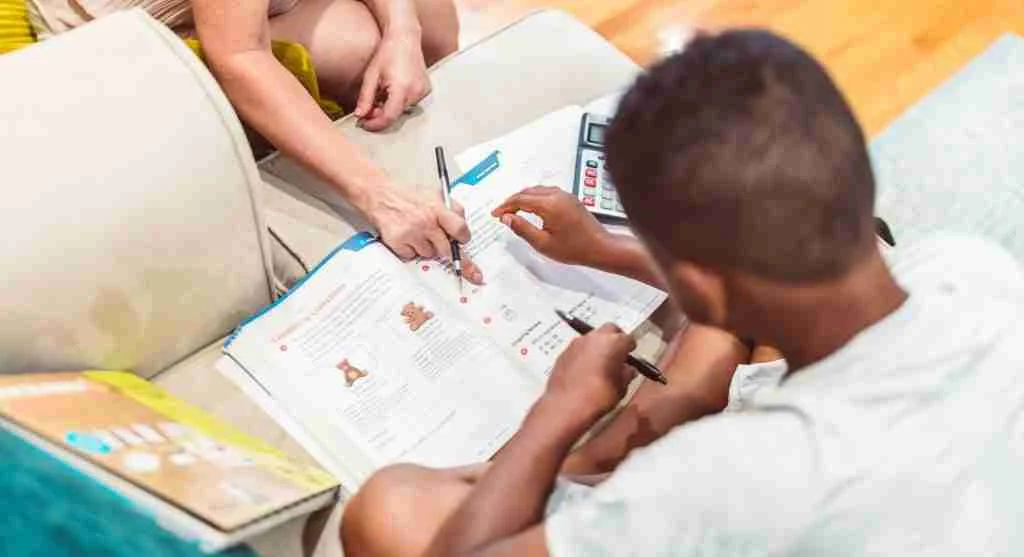 Parent helping a child explain a mistake more clearly during a calm conversation