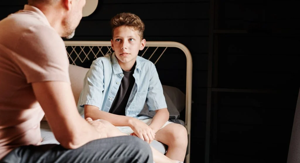 Parent listening to a child’s first concern before calmly holding a limit