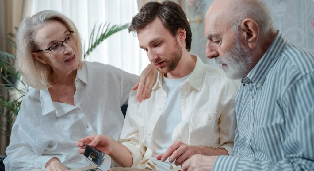 Family looking at repeated tradition photos together at home