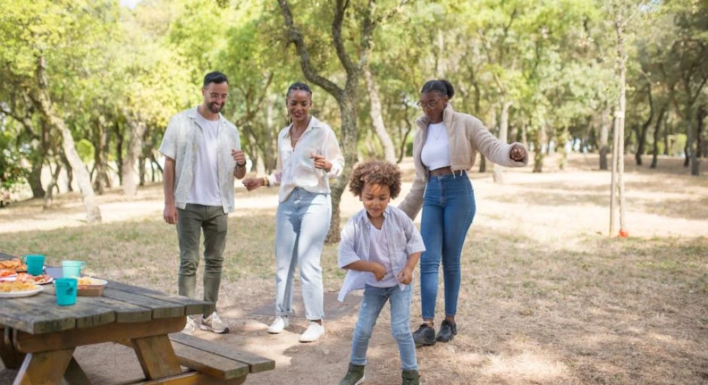 happy family having outdoor picnic